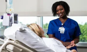 A Norton Healthcare nurse holds a patient's hand